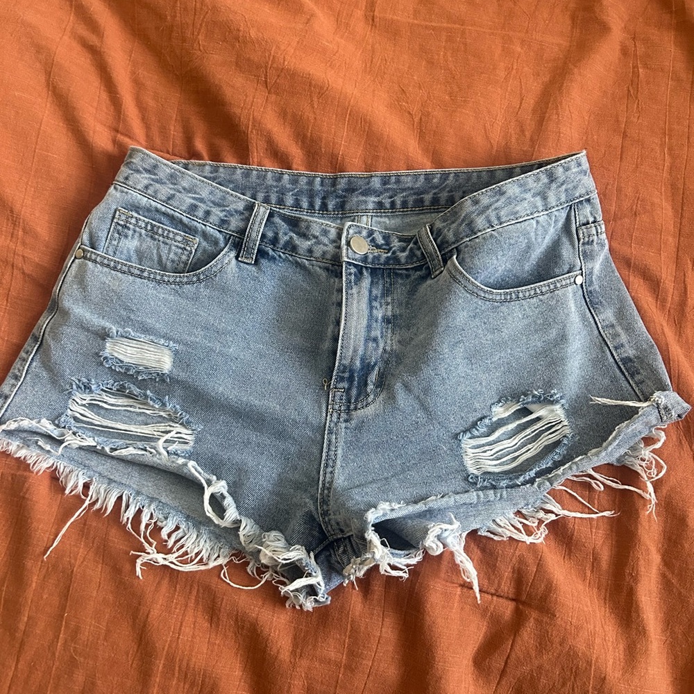 Light Jean shorts with stars on back, size Large